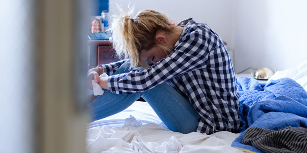 web3-woman-crying-bed-depression-shutterstock