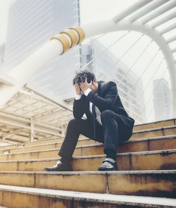 Business man failed to feeling hopeless, distraught, sad and dis