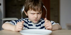 web3-boy-child-food-waiting-hungry-angry-fork-spoon-plate-shutterstock-300×150
