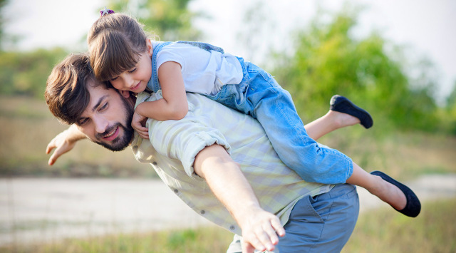 Attractive,Young,Man,Is,Playing,With,His,Daughter,In,The