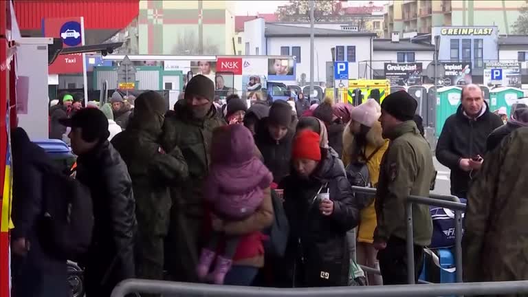 Refugees from Ukraine pour into in Polish camp close to border