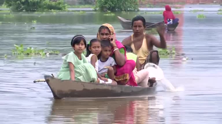 Thousands take shelter on highway in India’s flood-ravaged Assam