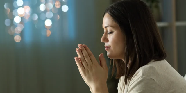 PRAY-WOMAN-CHURCH-shutterstock_1822640993